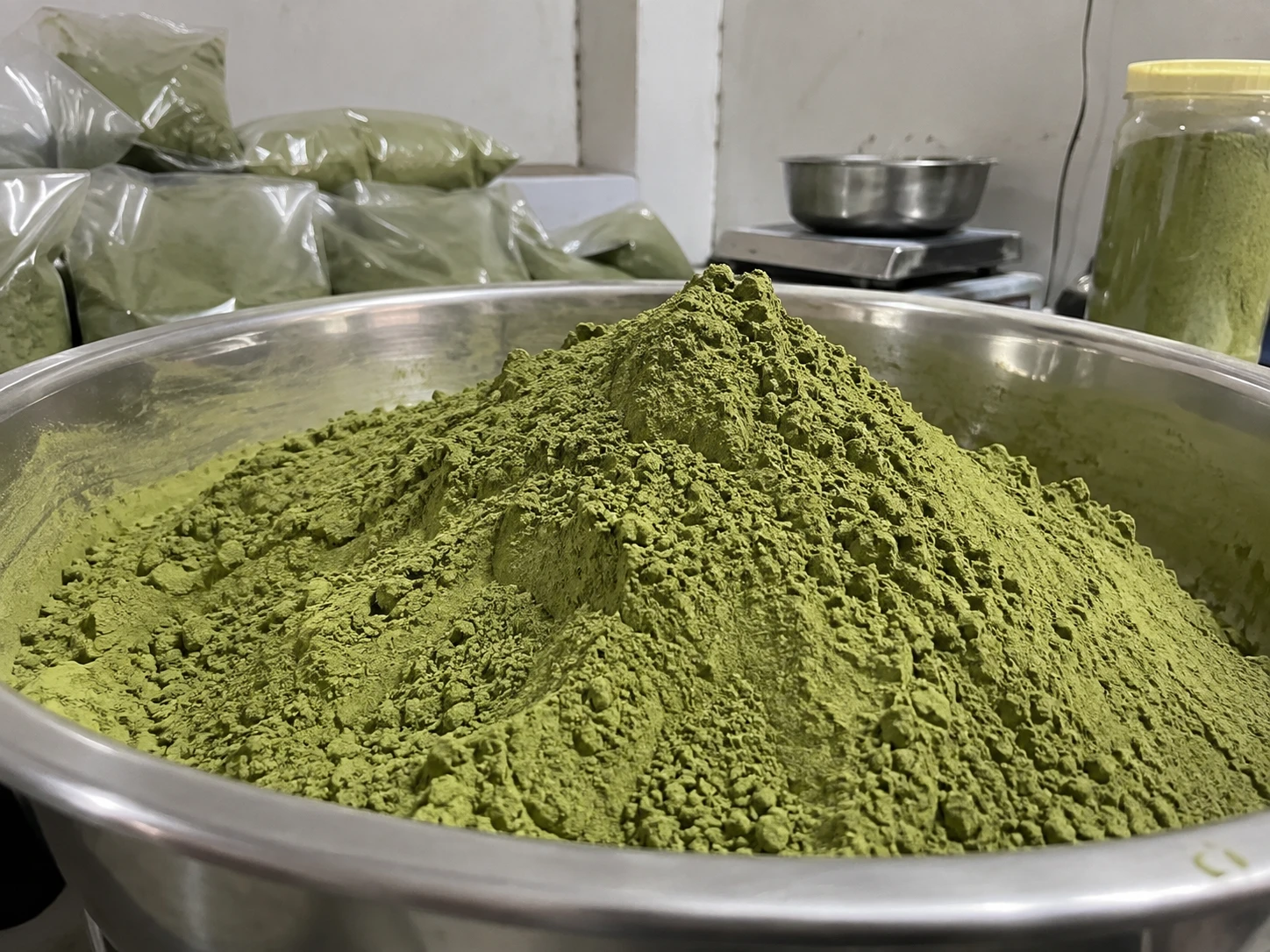 Bright green moringa leaf powder